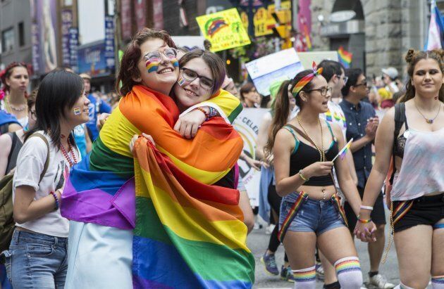 Two women hug during the 2017 Pride Parade in Toronto.