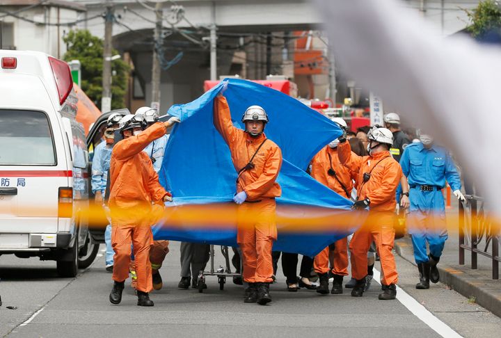 Rescuers work at the scene of an attack in Kawasaki, near Tokyo Tuesday, May 28, 2019. 