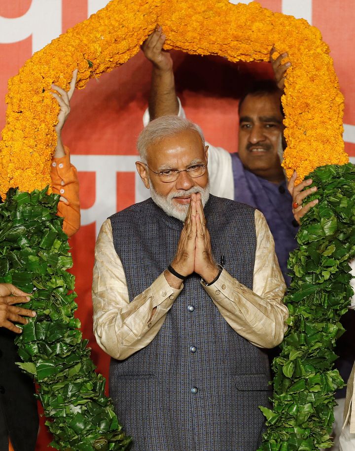 Narendra Modi being garlanded by BJP leaders after the election results in New Delhi on 23 May 2019.