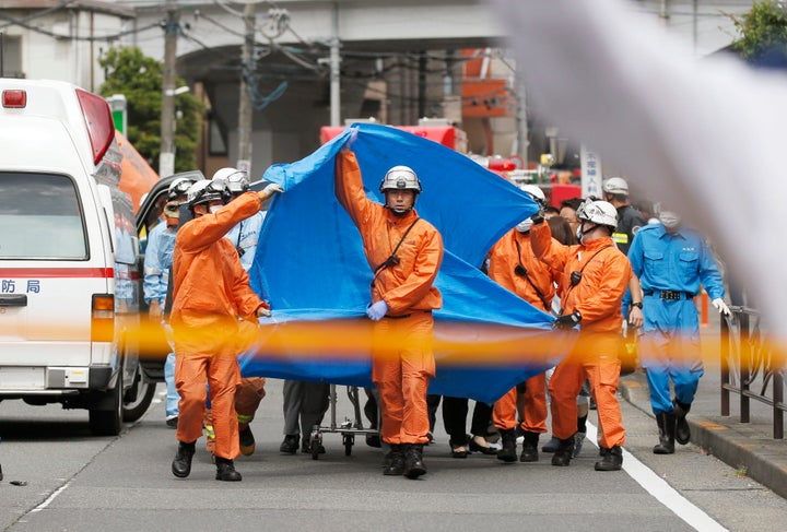 Rescuers work at the scene of an attack in Kawasaki, near Tokyo, on May 28, 2019.