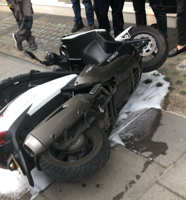 A moped was left outside the shop 