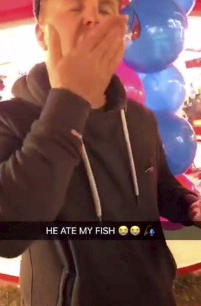 Joshua Coles, 27, of Tiverton, Devon, was filmed swallowing a goldfish which had been won at Bridgwater Fair last year. He was fined £300 and banned from keeping fish for five years. The fair has confirmed it will no longer offer fish as prizes. (SWNS)