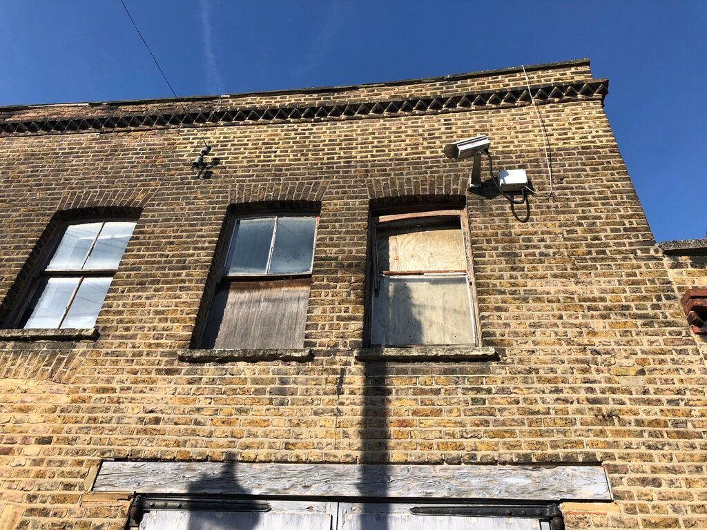 Windows at the Hewer Street property are boarded up