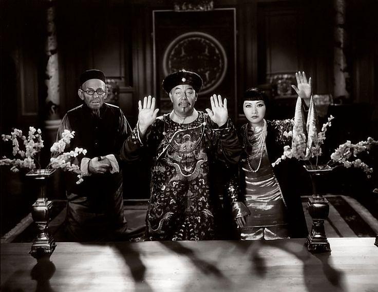 Actress Anna May Wong, at right, and actors E. Alyn Warren and Warner Oland -- two white men portraying Asians -- in a scene from the 1931 movie "Daughter of the Dragon."