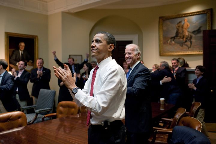 Obama and Biden in the Roosevelt Room, celebrating the Affordable Care Act's passage.