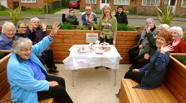 Lyndsey Young (centre, standing up) hosting afternoon tea at The Friendly Bench.