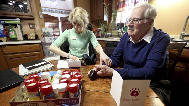 A hospice nurse pays a home visit in Dubuque, Iowa. States are taking steps to make palliative care available to more patients who don’t need hospice care.