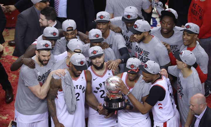 Members of the Toronto Raptors are seen here celebrating their victory over the Milwaukee Bucks in the Eastern Conference final on Saturday in Toronto, marking a new high for the NBA franchise. 