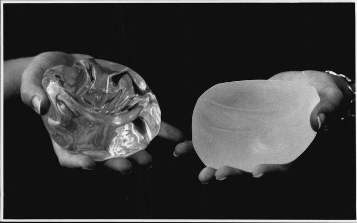 A smooth breast implant, left, compared with a textured breast implant, right.