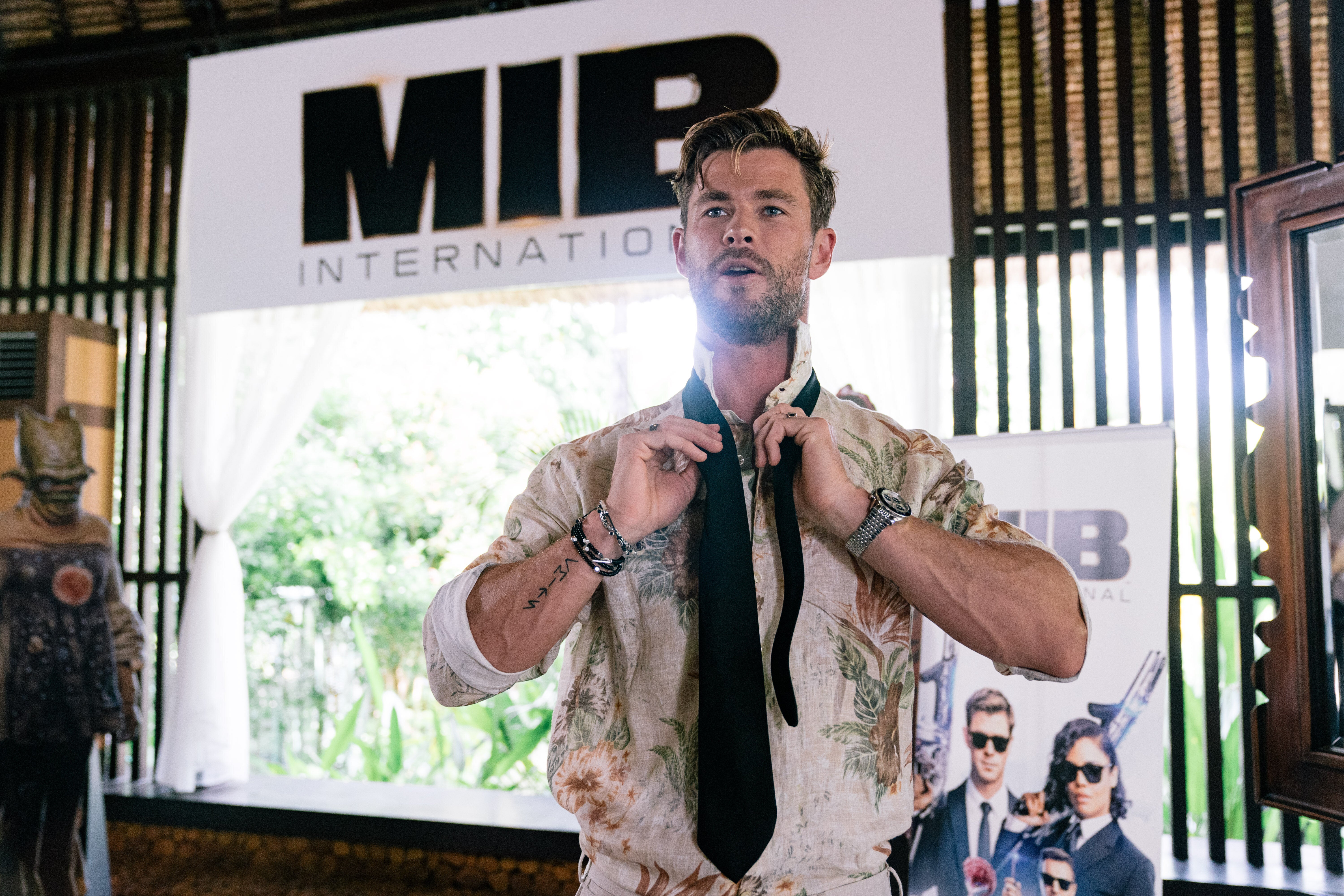 NUSA DUA, INDONESIA - MAY 27: Chris Hemsworth gives master class on how to tie the iconic MIB tie at "Men In Black: International" event at the St Regis Bali on May 27, 2019 in Nusa Dua, Indonesia. (Photo by Anthony Kwan/Getty Images for Sony Pictures Entertainment)
