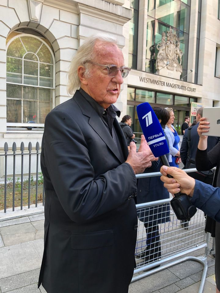 John Pilger outside Westminster Magistrates Court, where he warned that all media organisations are now in 'grave danger'