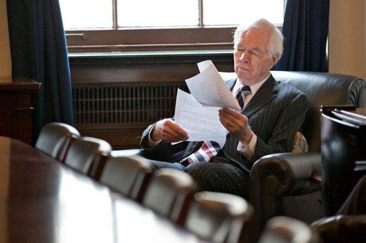 In this Dec. 4, 2013, file photo, Sen. Thad Cochran looks over documents before a closed-door meeting with other farm bill negotiators on Capitol Hill in Washington. The seven-term Republican died Thursday at age 81.