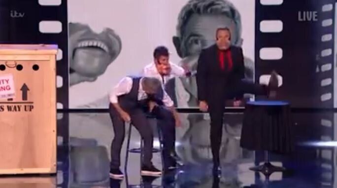 Simon stormed off stage after Jimmy grabbed at his legs