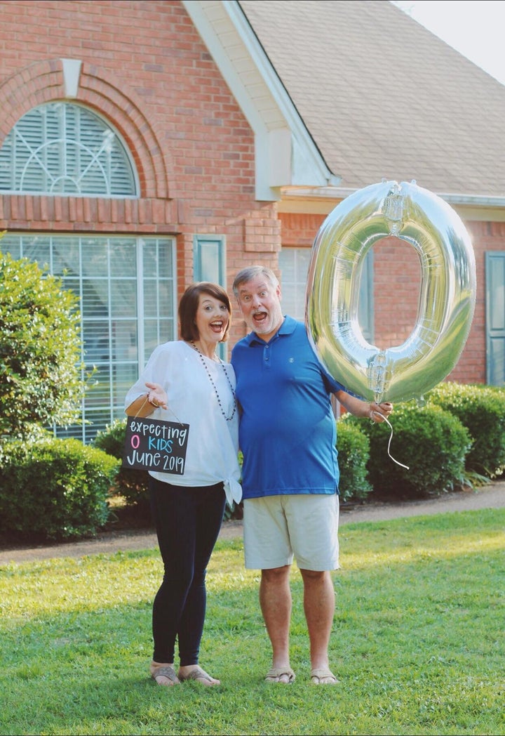 The chalkboard sign is reminiscent of the pregnancy announcement photo shoots you've probably seen all over Facebook. 