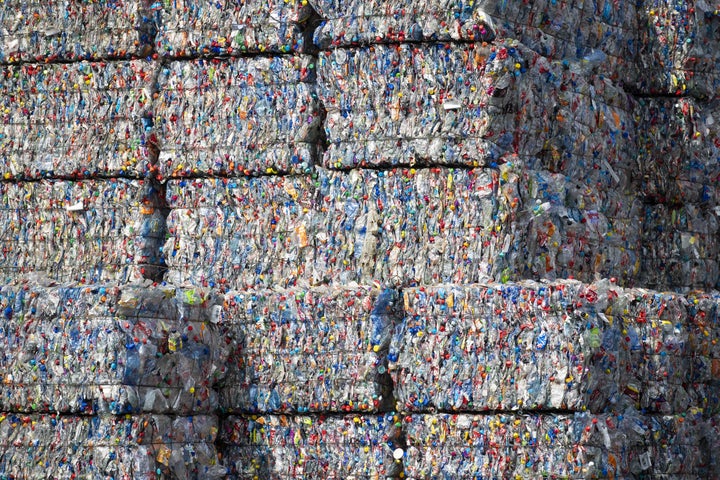 Sorting facilities like TotalRecycle crush plastics together into bales so they can be transported.