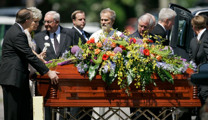 Mrs. George Tiller, second from left, follows the casket of her husband out of College Hill United Methodist Church in Wichita, Kansas, on June 6, 2009.