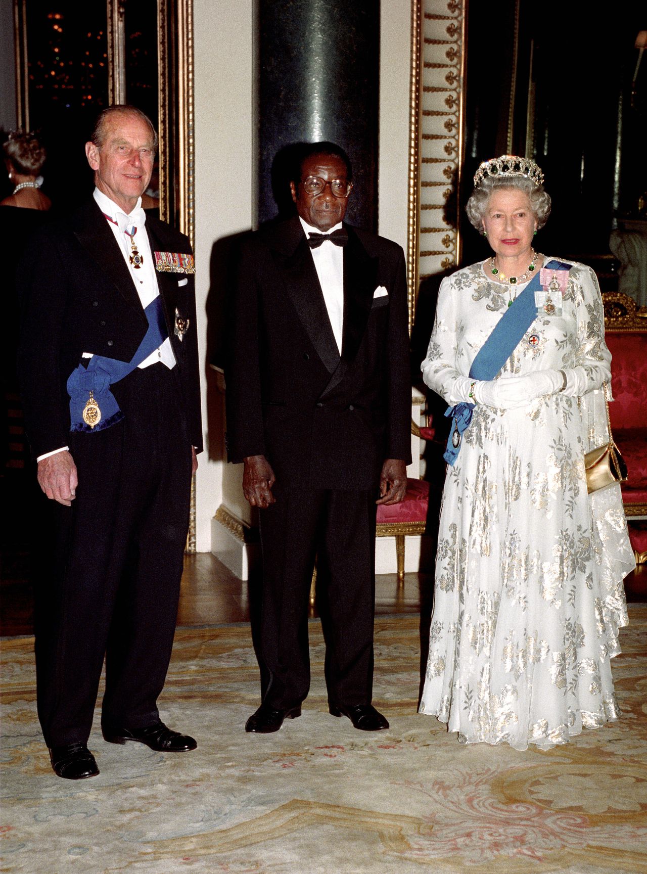 Prince Philip with Robert Mugabe and the Queen before a state banquet in 1994 