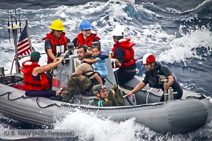 In a rescue boat with pararescuemen from the 131st Rescue Squadron of the California Air National Guard and sailors from the USS Vandegrift, in April 2014.