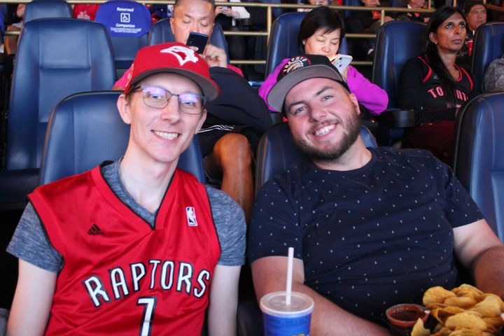 Raptors fans Michael and Cody take in the action of Game 1 of the NBA Finals from a downtown Vancouver movie theatre.