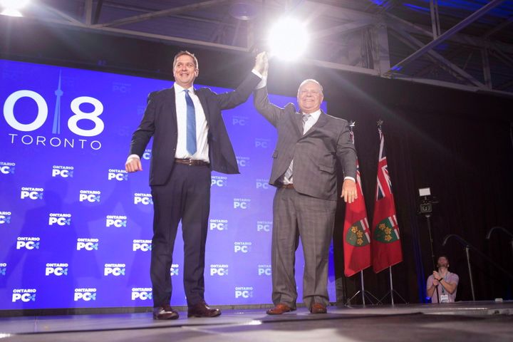 Federal Conservative Leader Andrew Scheer, left, is joined on stage by Ontario Premier Doug Ford after addressing the Ontario PC Convention in Toronto on Nov. 17, 2018.