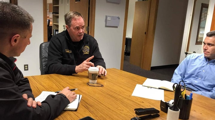 Commander Rex Caldwell, center, outlines Washington state’s training program to visiting officers from Oakland, California. Officials from other states and countries often look to Washington’s training standards.