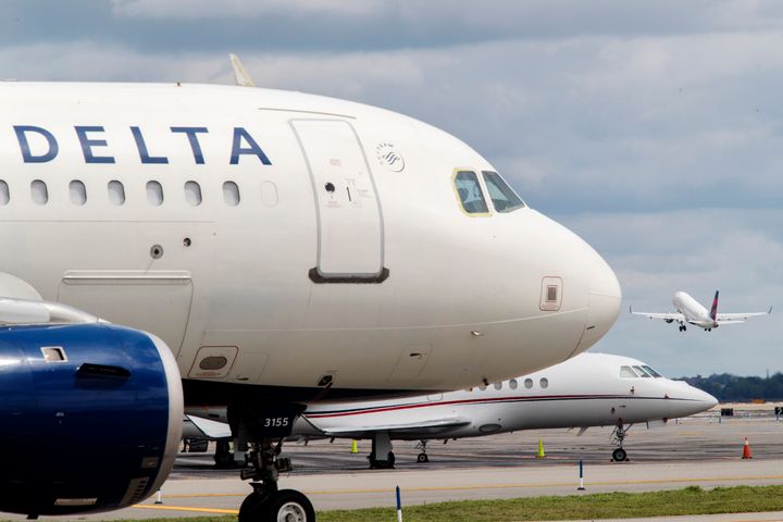 An employee in Delta’s operations control center sent a directive to a Delta gate agent directing them not to open the door of a delayed flight in order to keep the flight attendants onboard, according to internal communications reviewed by HuffPost.
