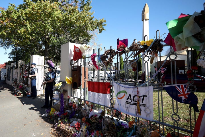 Armed police officers stand guard outside the Al Noor mosque in Christchurch, N.Z. during Friday prayers on May 3, 2019.