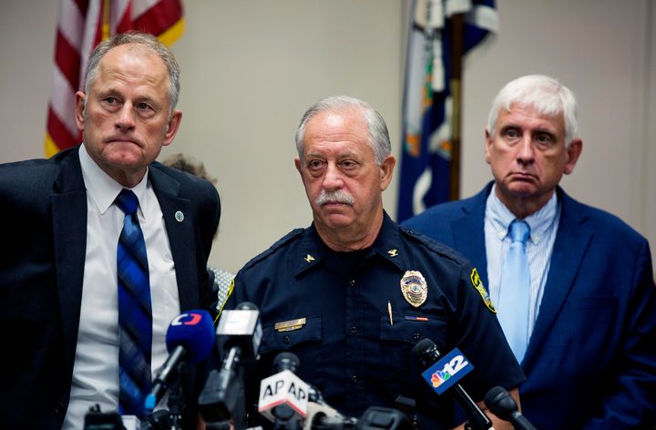 Virginia Beach City Manager Dave Hansen, left, Virginia Beach Chief of Police James Cervera, center, and Mayor Bobby Dyer listen during a news conference