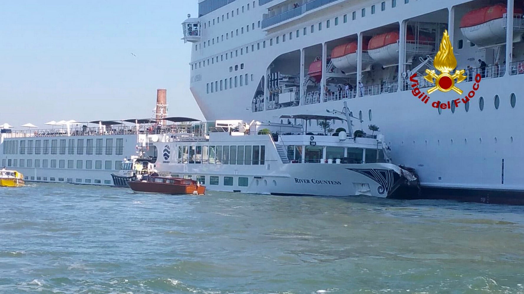 Several Injured After Huge Cruise Ship Crashes Into Tourist Boat, Dock