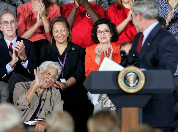 New Orleans chef Leah Chase waves to President Bush as the president acknowledges her during a speech at Jackson Barracks, which is the headquarters of the Louisiana National Guard in New Orleans, Wednesday, Aug. 20, 2008. 