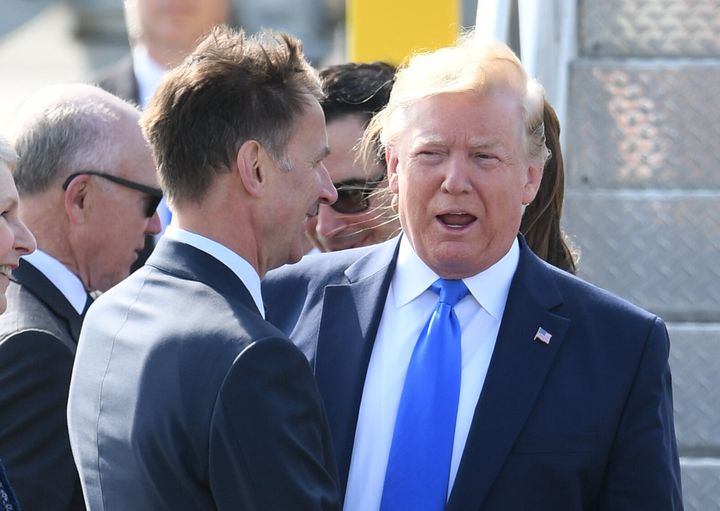 Trump was greeted by British Foreign Secretary Jeremy Hunt.