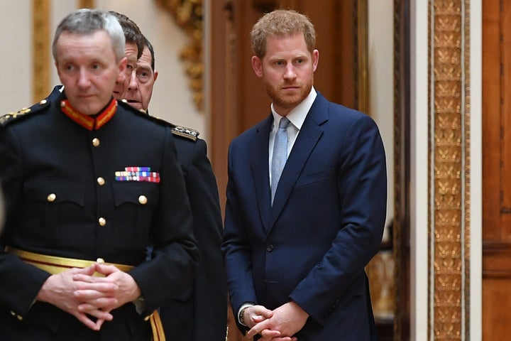 Prince Harry looks on as President Trump and his entourage begin their tour of the Royal Collection.