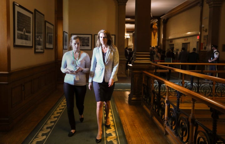 Attorney General Caroline Mulroney with her assistant on Sept. 13, 2018 at Queen's Park in Toronto. She has overseen the cuts to Legal Aid Ontario.