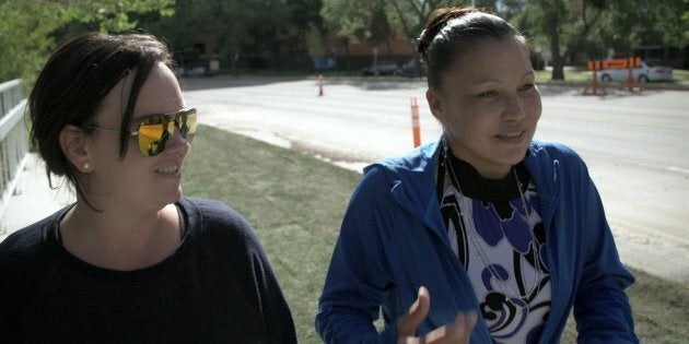 Avonlea, one of the participants in APTN's 'First Contact,' left, walks with educator Trina, right, in a screenshot from the show.