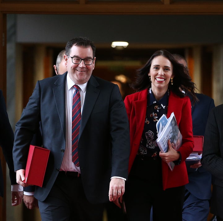 Finance minister Grant Robertson and prime minister Jacinda Ardern walk to the house during the 2019 budget presentation at P