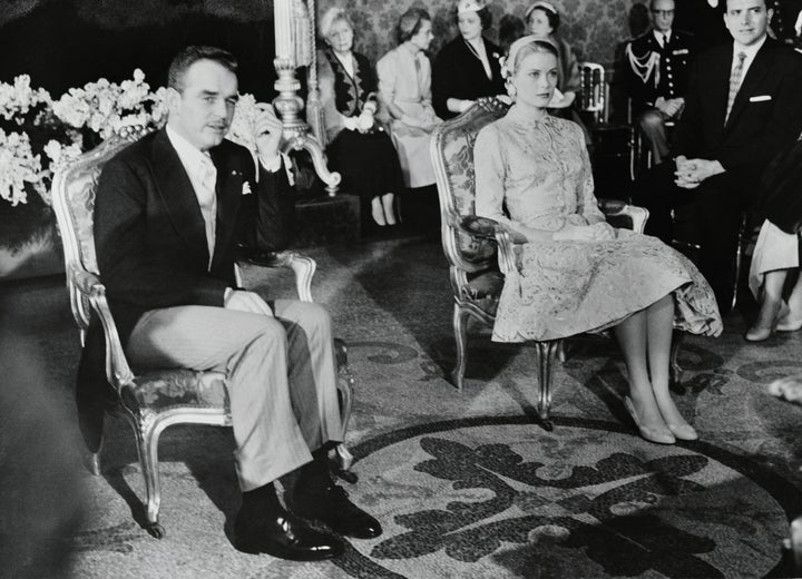 Grace, in a brocade skirt and jacket ensemble, pictured with Rainier at their civil wedding ceremony on April 18, 1956. The religious ceremony took place the following day.