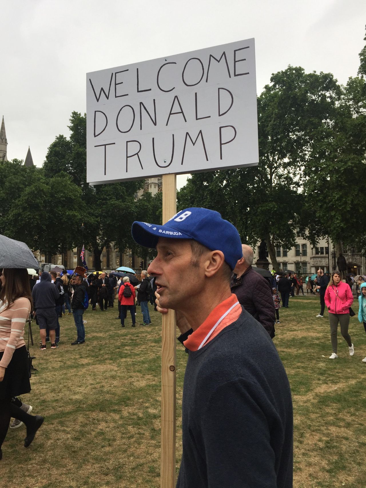 Ricky Bohanan, 60, holds his ‘Welcome Donald Trump’ sign at a rally against the US leader in London on Tuesday.