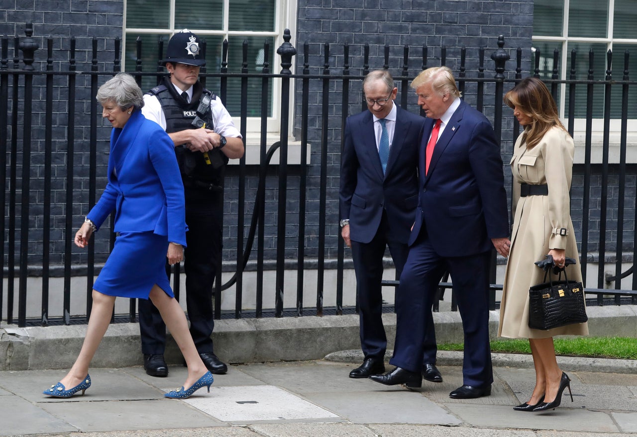 Prime Minister Theresa May and her husband Philip greet Donald Trump and first lady Melania outside 10 Downing Street in central London, Tuesday, June 4, 2019. May and Trump didn't shake hands during the meeting.