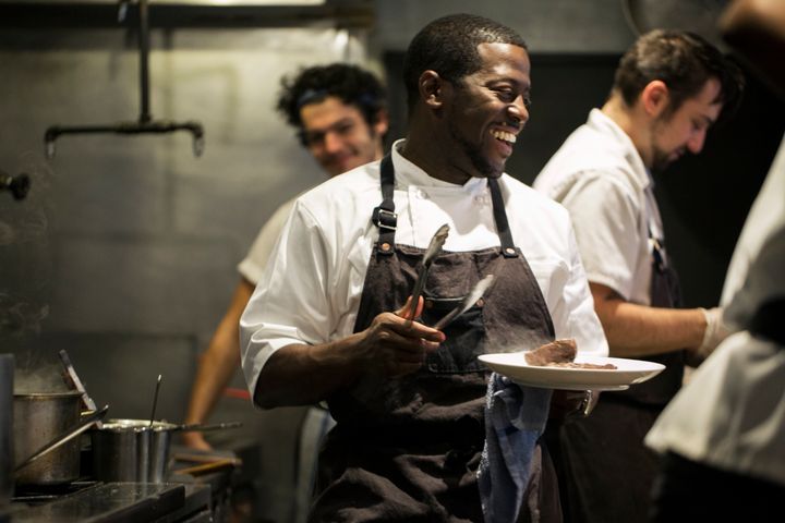 Chef Edouardo Jordan works the line at one of his Seattle restaurants, Salare.