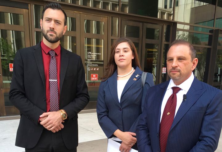 Tahnee Gonzales stands with her attorneys Marc Victor (right) and Andrew Marcantel outside the courthouse in downtown Phoenix on March 29, 2018.