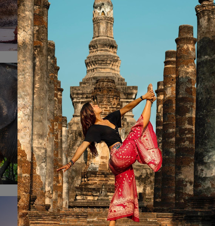 Yoga instructor Andreita Levin posing at Sukhothai Historical Park.