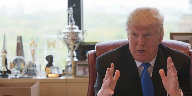 Republican presidential candidate Donald Trump gestures as he speaks during an interview with The Associated Press in his office at Trump Tower, Tuesday, May 10, 2016, in New York. (AP Photo/Mary Altaffer)