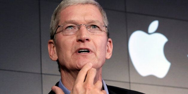 FILE - In this April 30, 2015 file photo, Apple CEO Tim Cook responds to a question during a news conference at IBM Watson headquarters, in New York. Apple CEO Tim Cook laid out his companyâs plans for the vast Indian market in a meeting Saturday, May 21, 2016, with Prime Minister Narendra Modi, who in turn sought Apple's support for his "Digital India" initiative focusing on e-education, health and increasing farmers' incomes. (AP Photo/Richard Drew, File)
