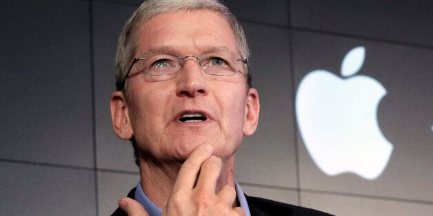 FILE - In this April 30, 2015 file photo, Apple CEO Tim Cook responds to a question during a news conference at IBM Watson he
