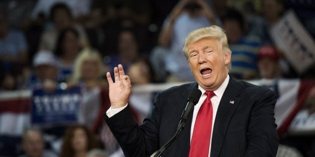 Donald Trump, 2016 Republican presidential nominee, speaks during a campaign rally at the Erie Insurance Arena in Erie, Pennsylvania, U.S., on Friday, Aug. 12, 2016. Two days after Trump said that President Barack Obama had founded Islamic State, and a day after he insisted that he meant what he said, the Republican presidential nominee reversed himself on Friday and claimed the statement was nothing more than sarcasm. Photographer: Ty Wright/Bloomberg via Getty Images