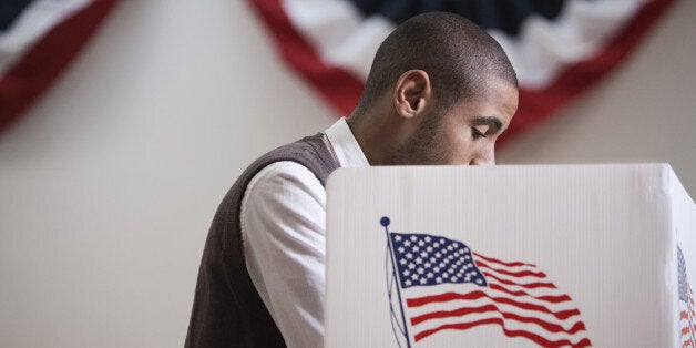 Hispanic voter voting in polling place