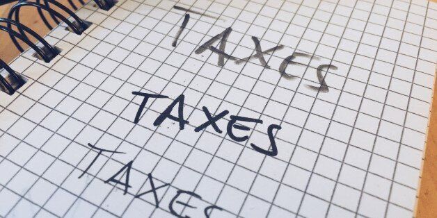 Taxes Written On Diary