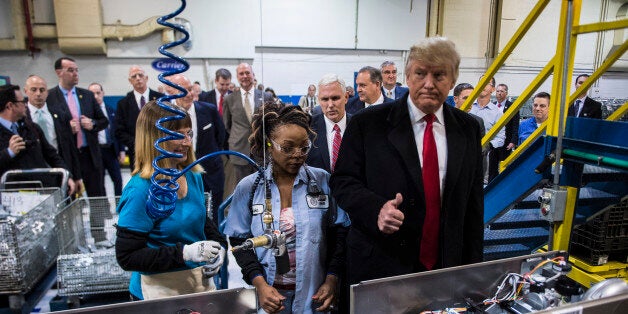 INDIANAPOLIS, IN - DECEMBER 1: President-elect Donald Trump and Vice President-elect Mike Pence meet workers as they take a tour of Carrier Corporation in Indianapolis, IN on Thursday, Dec. 01, 2016. (Photo by Jabin Botsford/The Washington Post via Getty Images)