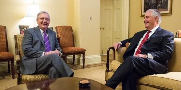 Senate Majority Leader Mitch McConnell (R-KY) speaks to Secretary of State Nominee Rex Tillerson(R) before the start of a meeting on Capitol Hill January 4, 2017 in Washington, DC. / AFP / ZACH GIBSON (Photo credit should read ZACH GIBSON/AFP/Getty Images)