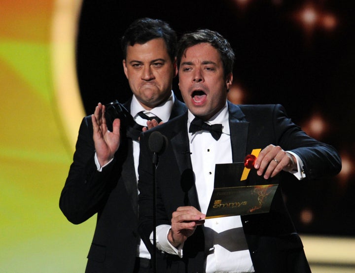 LOS ANGELES, CA - SEPTEMBER 18: TV show host's Jimmy Kimmel (L) and Jimmy Fallon speak onstage during the 63rd Annual Primetime Emmy Awards held at Nokia Theatre L.A. LIVE on September 18, 2011 in Los Angeles, California. (Photo by Kevin Winter/Getty Images)